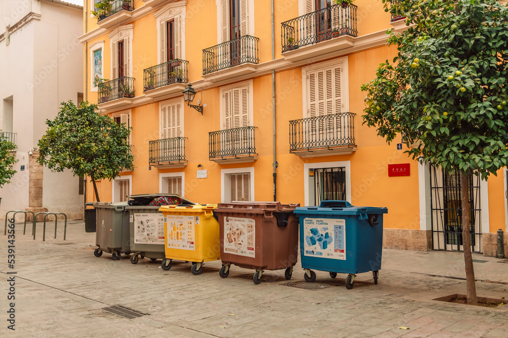 October 16 Valencia, Spain: Plastic color trashcans for separation of rubbish at city street