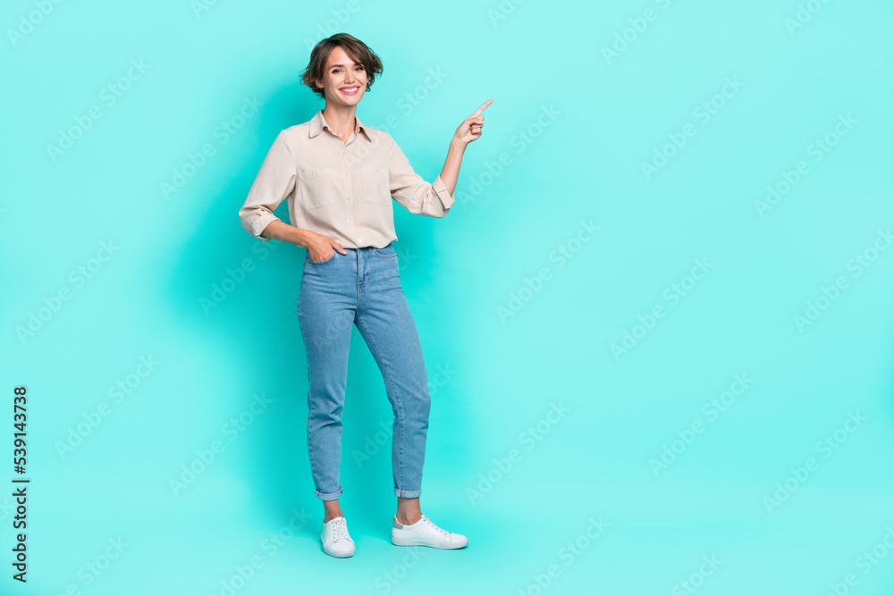 Full length photo of cheerful satisfied girl arm index present empty space recommend delivery service isolated on cyan color background