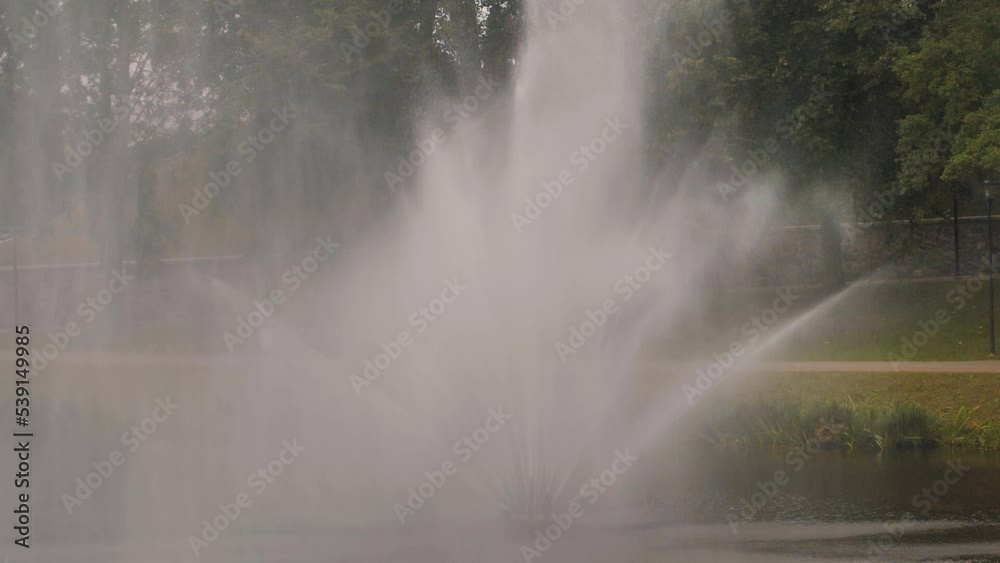 Large fountain in the park in autumn