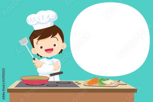 Cute Boy little chef present cooking in the kitchen