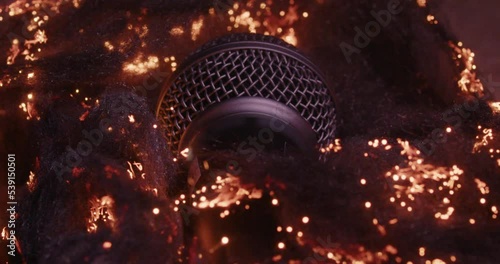 Microphone (Shure SM58) with many sparks around the outside. Good for music (rap) videos and more photo