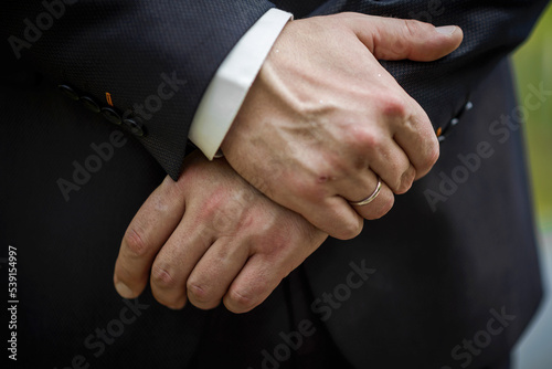 man and woman with wedding ring.Young married couple holding hands,