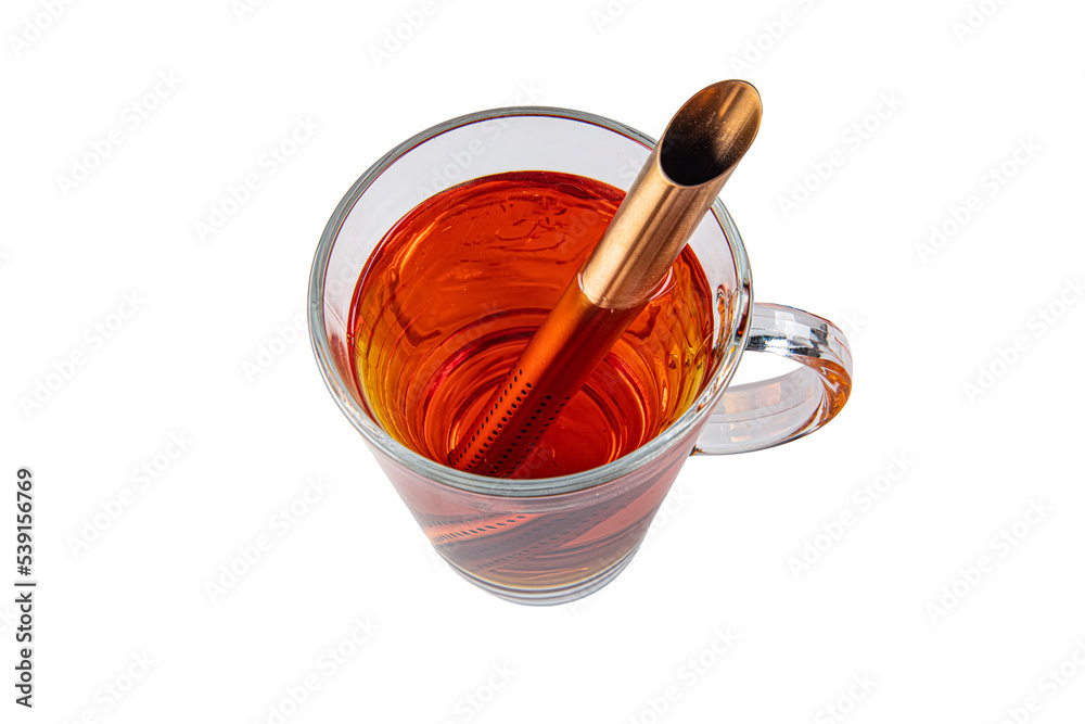 A cup of rooibos tea. Close-up view of a refreshing cup of tea in a plain white glass. A cup of rooibos tea. Close-up view of a refreshing cup of tea in a plain white glass.