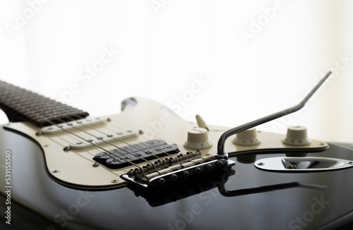 Canvastavla Electric guitar body black color stratocaster shape on moring low light