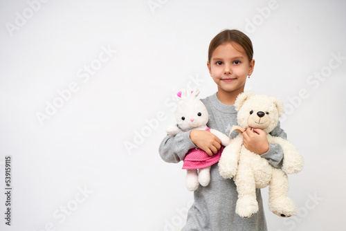 Portrait of little girl with white toy bear © Gecko Studio