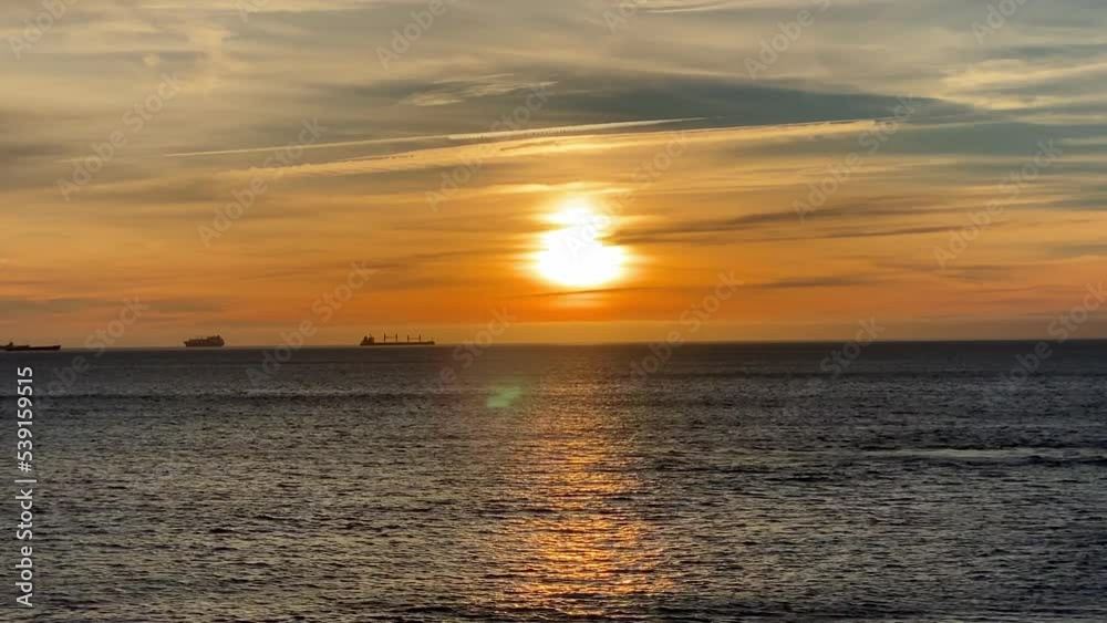 4k Big Sunset Over Ocean,Sunrise Time Lapse over some good waves. Some surfers enjoying the sea. 4k Big Sunset Over Ocean,Sunrise Time Lapse over some good waves. Some surfers enjoying the sea.