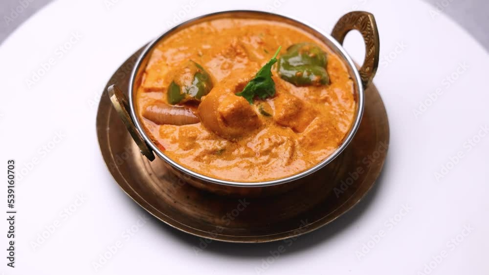 Kadai Paneer is a spicy, flavourful and delicious gravy dish made with paneer, bell pepper, and onion in a freshly ground spice and served with lachcha parantha and onion Kadai Paneer is a spicy, flavourful and delicious gravy dish made with paneer, bell pepper, and onion in a freshly ground spice and served with lachcha parantha and onion