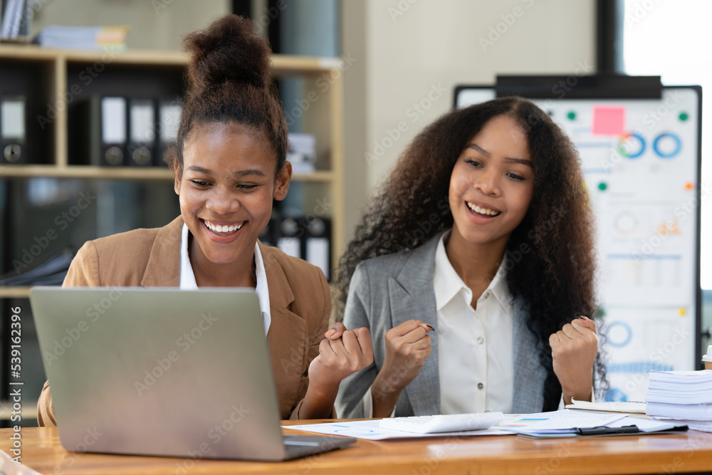 Smiling young black businesswoman working with partner at office. finance concept. Smiling young black businesswoman working with partner at office. finance concept.