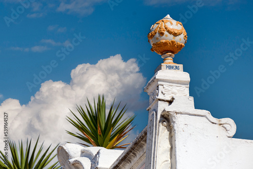 pediment and earthenware balls on a restored house in Olhao, Algarve, Portugal