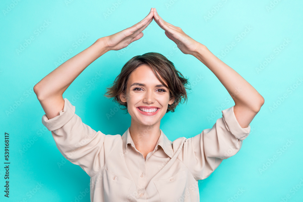 Photo of pretty lovely lady arm demonstrate roof under head buy new flat rejoice cool purchase isolated on cyan color background Photo of pretty lovely lady arm demonstrate roof under head buy new flat rejoice cool purchase isolated on cyan color background