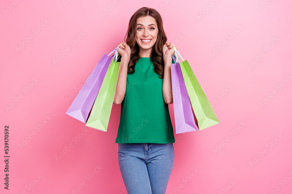 Photo of adorable positive glad lady dressed trendy outfit satisfied new clothes purchase isolated on pink color background