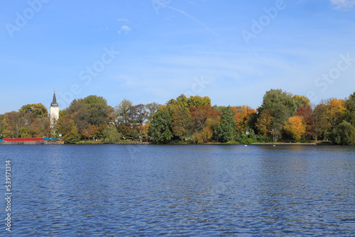 View to peninsula Alt-Stralau on river Spree with his old church in Berlin - Germany