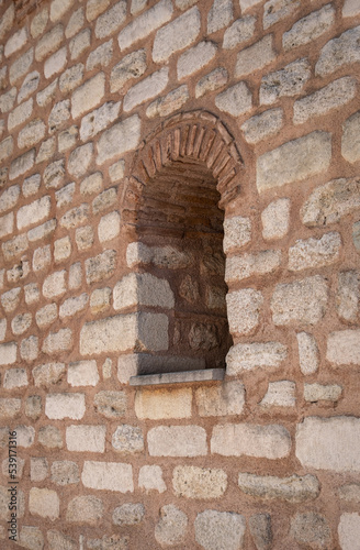 old window in the stone wall. historic building.