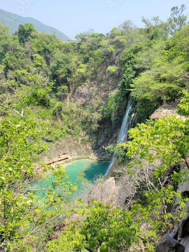 top shot of the Minas Viejas waterfall falling into a turquoise blue pool