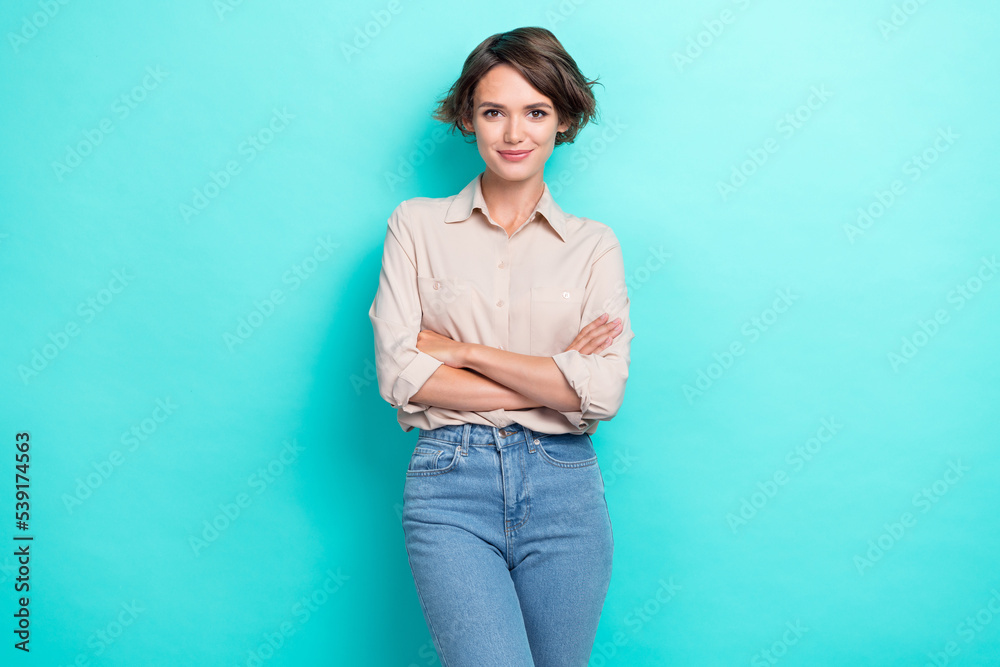Photo of young confident serious pretty business lady folded arms success career now became profession specialist isolated on aquamarine color background Photo of young confident serious pretty business lady folded arms success career now became profession specialist isolated on aquamarine color background