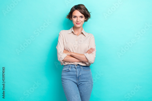 Photo of young confident serious pretty business lady folded arms success career now became profession specialist isolated on aquamarine color background