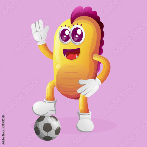 Cute yellow monster play football, soccer ball