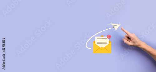 Businessman hand holding letter icon,email icons.Contact us by newsletter email and protect your personal information from spam mail.Customer service call center contact us.Email marketing newsletter.