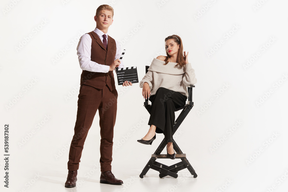Obraz premium Pretty young women in retro 90s fashion style, outfits isolated over white studio background. Concept of eras comparison, beauty, fashion and youth.