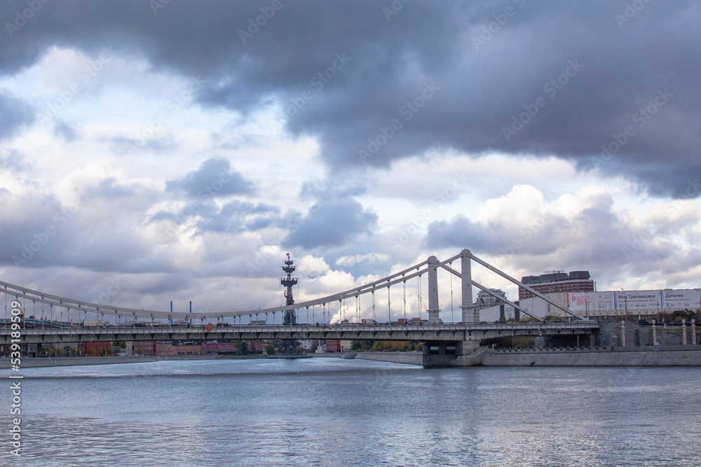 Moscow, Russia - october 5, 2022: Hanging Crimean bridge over the Moskva River. Bridge structure consists of two pairs of pylons suspended on chains with a length of 297 meters Moscow, Russia - october 5, 2022: Hanging Crimean bridge over the Moskva River. Bridge structure consists of two pairs of pylons suspended on chains with a length of 297 meters
