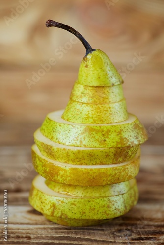Fruit yellow ripe pear, cut into pieces. Vegetarian diet.