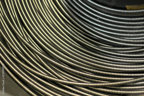 High resolution close up shot of metal cable sling for engineering, construction and building. twisting of metal ropes