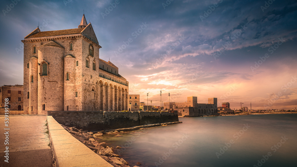 Trani cathedral over the sea stunning sunset sky