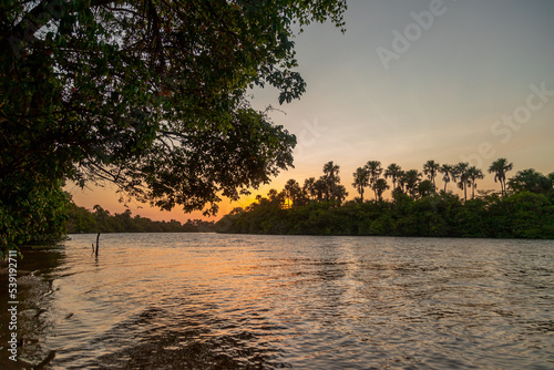 POR DO SOL NO RIO PREGUIÇA