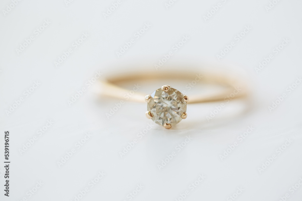 One old gold rind with diamant on white background. Diamant in focus One old gold rind with diamant on white background. Diamant in focus