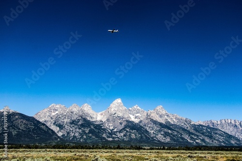 Plane Over The Mountains