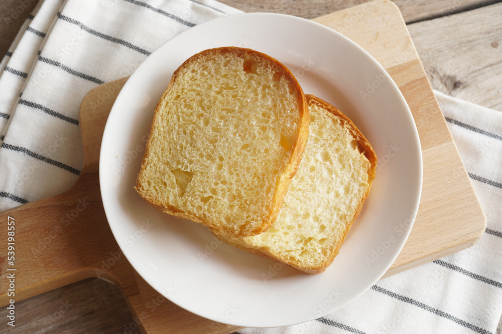 Homemade fresh bread on wooden table Homemade fresh bread on wooden table