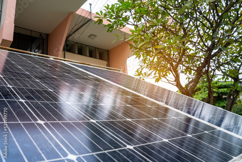 Photography Blue Solar Photo voltaic panels system of apartment building on sunny day