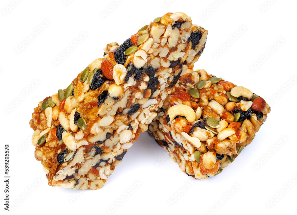 Two pieces of gozinak from different nuts isolated on white background. Two pieces of gozinak from different nuts isolated on white background.