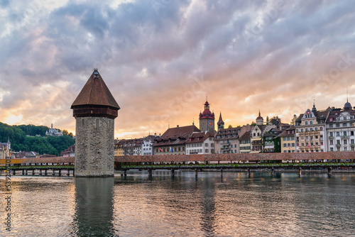 Fotografie, Obraz Lucerne (Luzern) Switzerland, sunset city skyline at Chapel Bridge