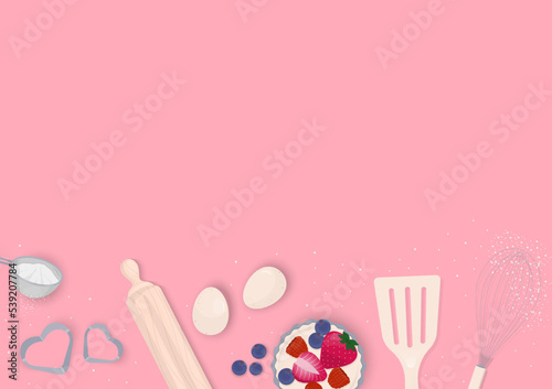 Cooking utensils with cupcake on pink background