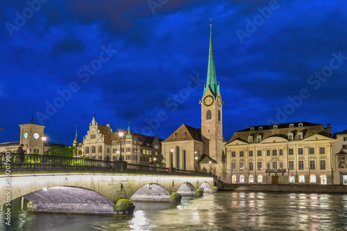 Zurich Switzerland  night city skyline at Fraumunster Church and Munster Bridge