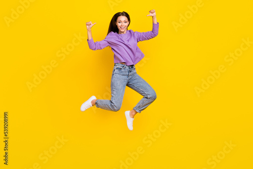 Full length photo of overjoyed funky lady two arms fingers direct herself celebrate success achievement isolated on yellow color background