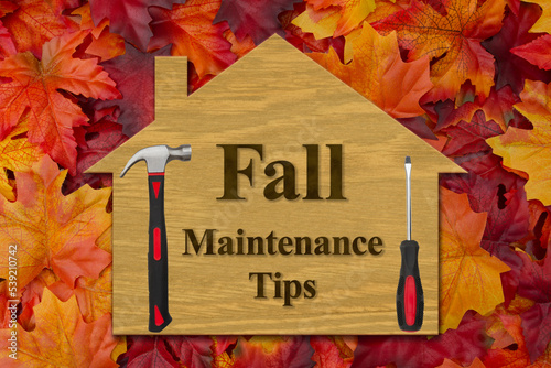 Home Maintenance Tips sign with fall leaves