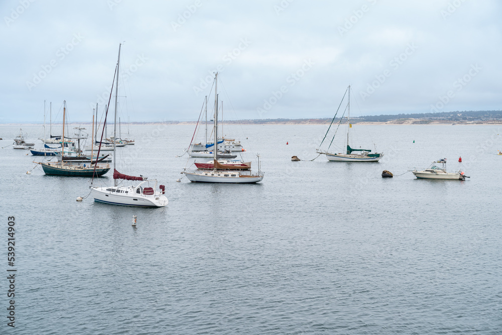 California, USA - May 18, 2018: sailing boats on the sea near old fishermanâs wharf under blue sky in the city of Monterey