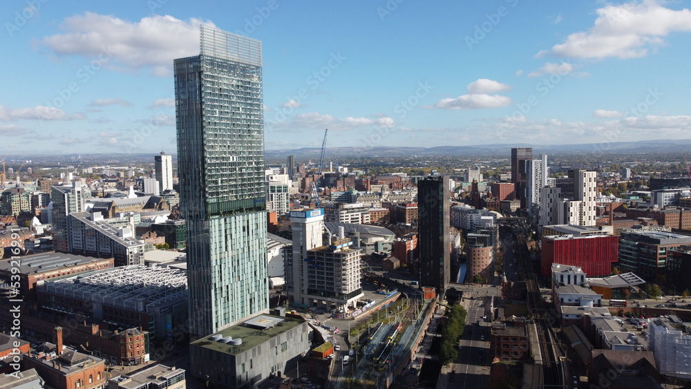 Aerial view of Manchester City centre with modern buildings and landmarks. 