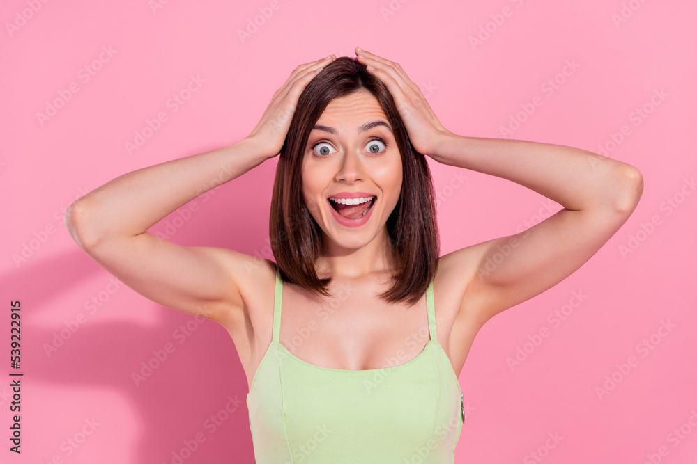 Photo of sweet impressed young girl dressed green outfit arms head open mouth you kiss isolated pink color background Photo of sweet impressed young girl dressed green outfit arms head open mouth you kiss isolated pink color background