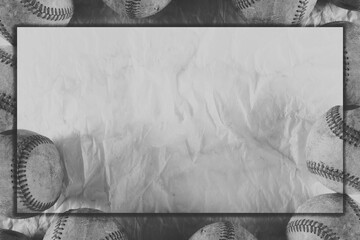 Old baseball grit with frame on vintage texture background over used game balls in black and with for sport copy space as graphic.