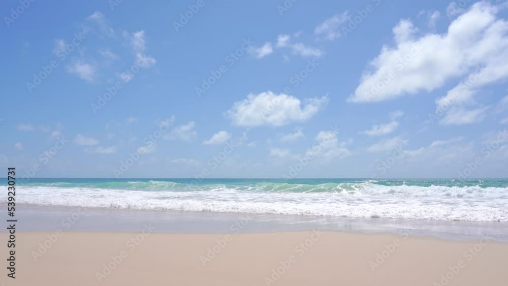 Sea golden sand clear beach sunny. blue sky white clouds daytime. Waves water smoothly shore side. Sea golden sand clear beach sunny. blue sky white clouds daytime. Waves water smoothly shore side.