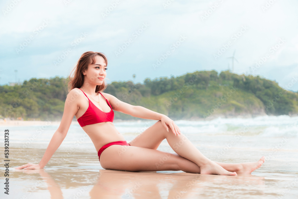beautiful young asian woman with red bikini sit on the beach. Holiday and summer travel concept Portrait video beautiful young asian woman with red bikini sit on the beach. Holiday and summer travel concept Portrait video