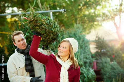 Tree Lot: Couple Carrying Out Christmas Tree