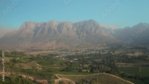 Aerial view over the green vineyards and rugged mountains of Banhoek and Franschhoek valley in Stellenbosch in South Africa