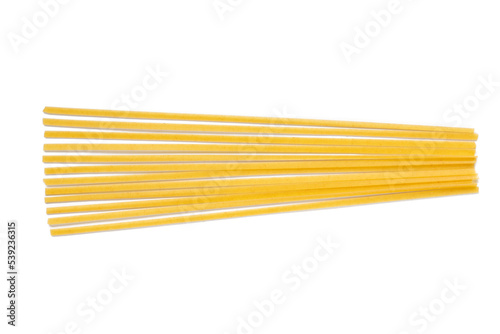 Pile of uncooked dry durum fettuccine pasta isolated on white background. Raw spaghetti or noodles