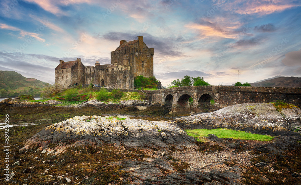 Eilean Donan Castle with at dramatic sunset, Scotland.