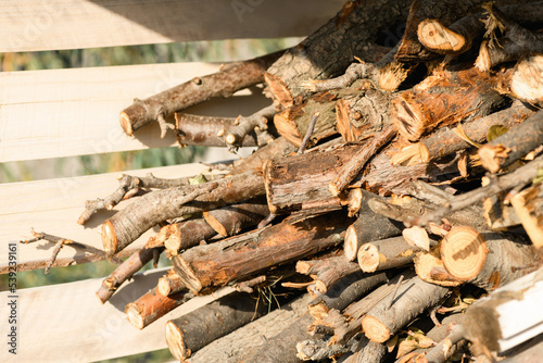 Stocks of wooden firewood close-up. Preparing for winter, world energy crisis