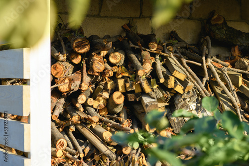 Stocks of wooden firewood close-up. Preparing for winter, world energy crisis photo